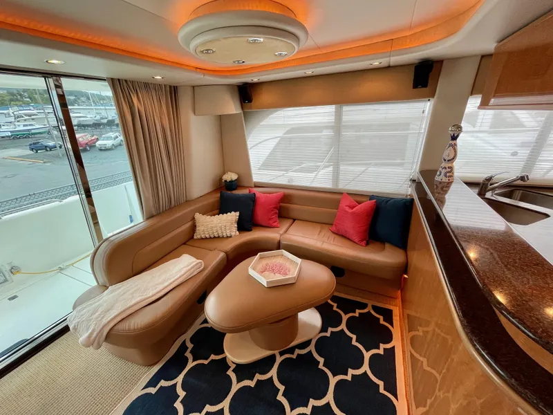Slide: The Image of Luxurious interior of 2002 Bayliner 5788 yacht with modern decor and comfortable seating. - 9