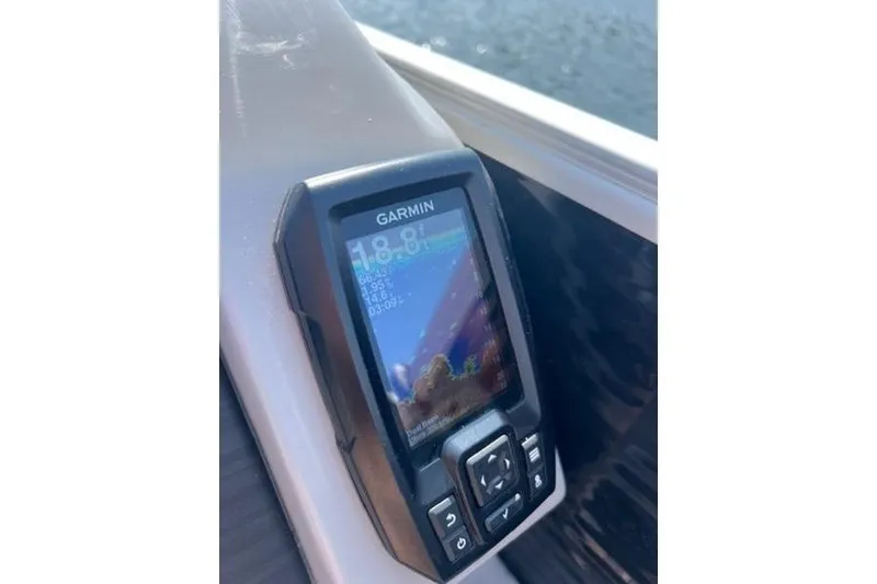 Slide: The Image of Garmin device on 2021 Bennington 23 LSB boat, displaying water depth. - 11