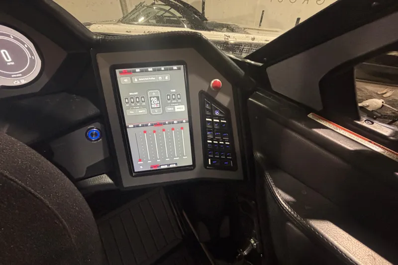 Slide: The Image of 2022 MasterCraft XStar dashboard with touchscreen controls and digital display. - 16