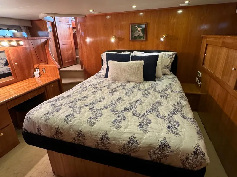 Slide: The Image of Luxurious bedroom in 2002 Navigator 5700 Rival yacht with elegant wood paneling. - 19