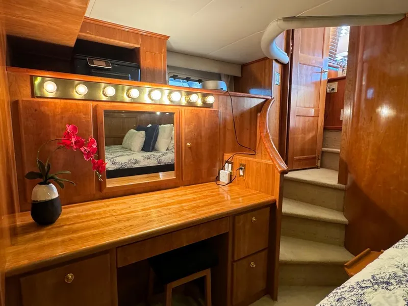 Slide: The Image of Luxurious 2002 Navigator 5700 Rival yacht interior with vanity and staircase. - 20