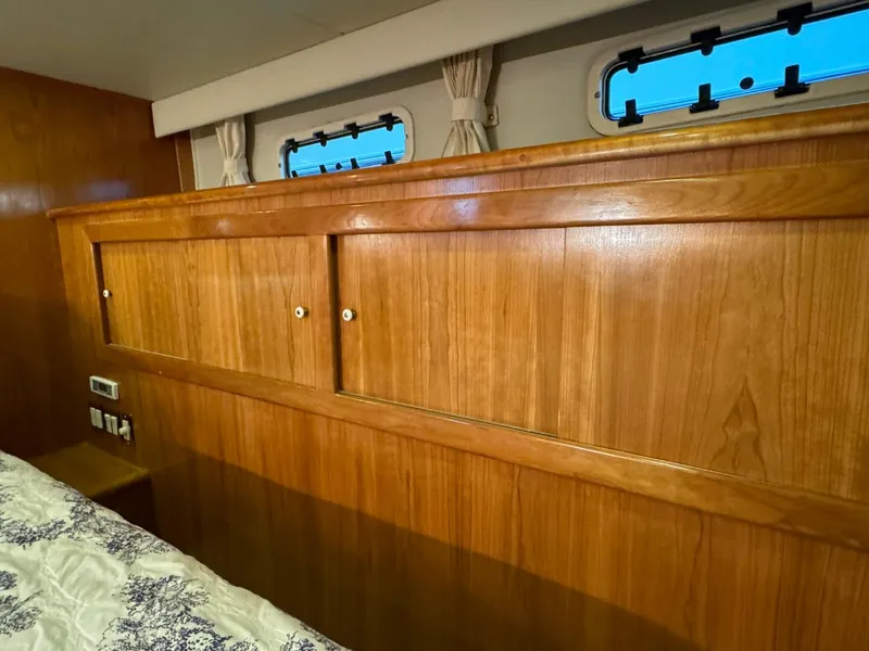 Slide: The Image of Wooden interior of 2002 Navigator 5700 Rival yacht cabin with storage cabinets. - 21