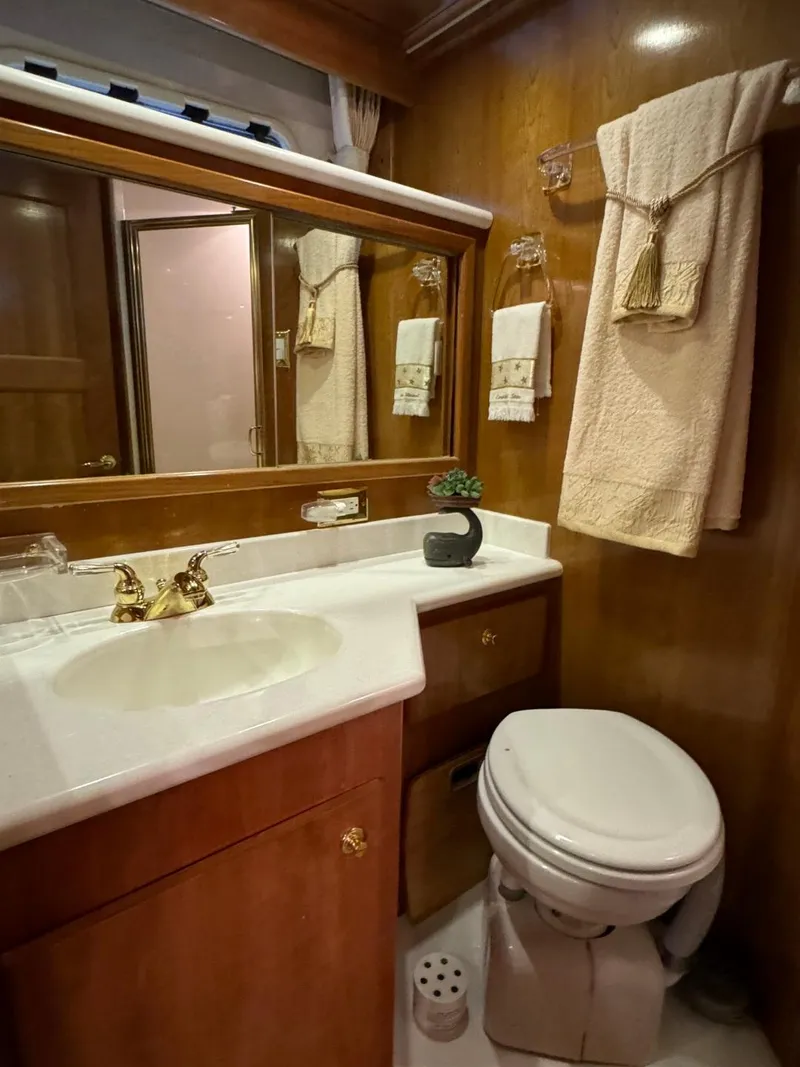 Slide: The Image of Luxurious bathroom in 2002 Navigator 5700 Rival yacht with elegant wood finish. - 24