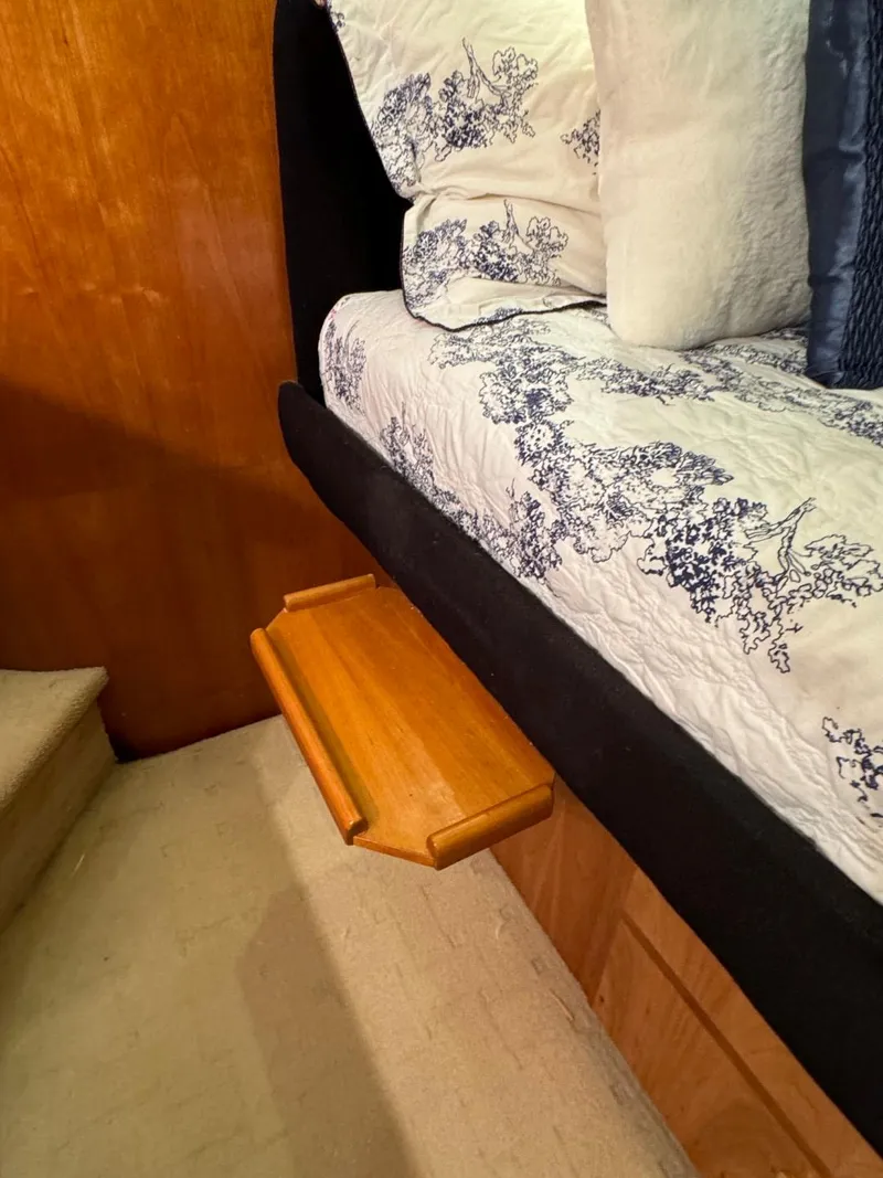 Slide: The Image of Wooden shelf beside bed in 2002 Navigator 5700 Rival yacht interior. - 25