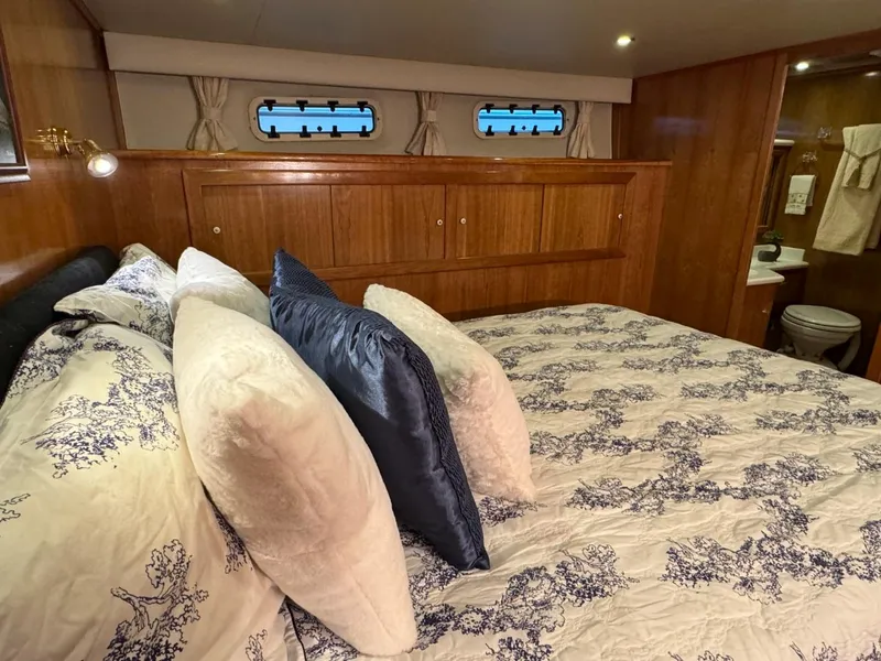 Slide: The Image of Luxurious bedroom interior of 2002 Navigator 5700 Rival yacht with elegant bedding. - 26
