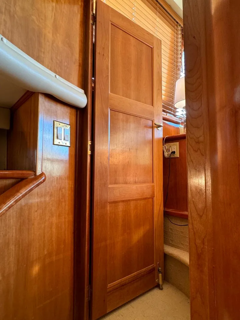 Slide: The Image of Wooden interior of 2002 Navigator 5700 Rival yacht with door and stairs. - 27
