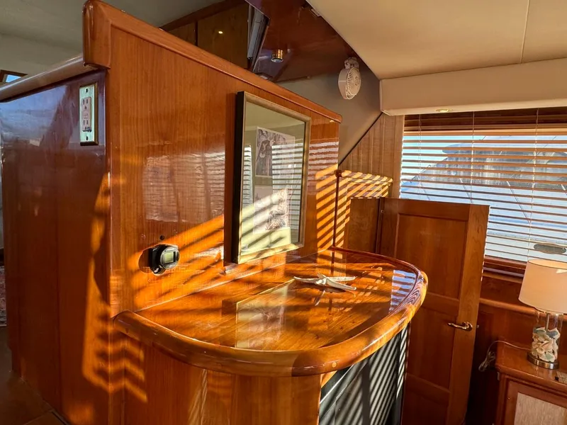 Slide: The Image of Wooden interior of 2002 Navigator 5700 Rival yacht with sunlight streaming through blinds. - 30