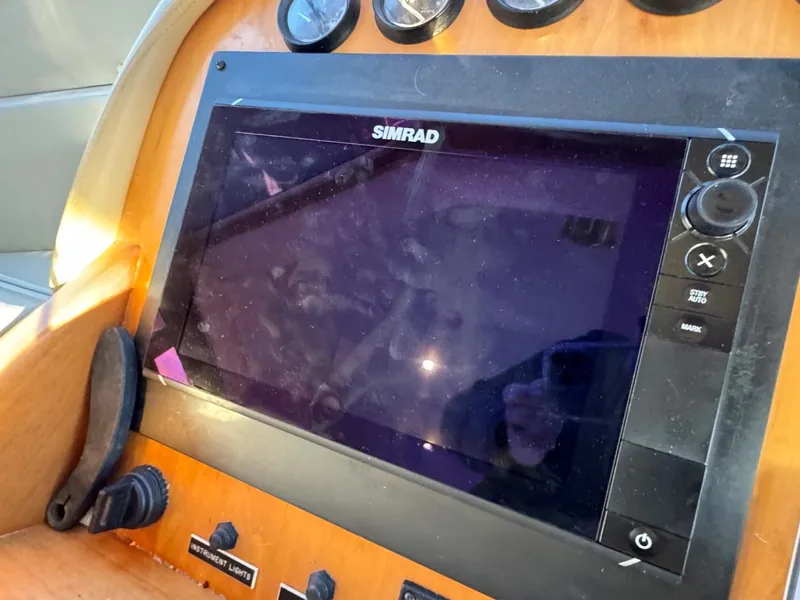Slide: The Image of Simrad navigation system on 2002 Navigator 5700 Rival boat dashboard. - 37