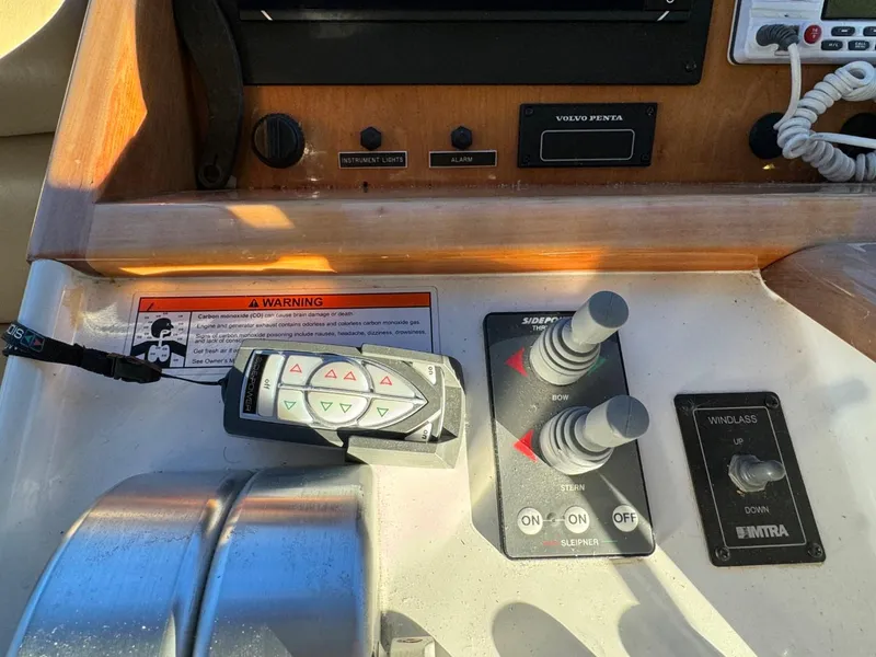 Slide: The Image of Control panel of 2002 Navigator 5700 Rival boat with joystick and warning label. - 38