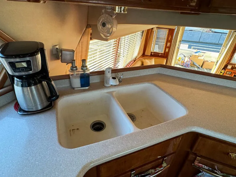 Slide: The Image of Navigator 5700 Rival 2002 kitchen with dual sink and coffee maker. - 46