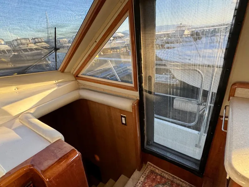 Slide: The Image of Interior of a 2002 Navigator 5700 yacht with stairs and window. - 49