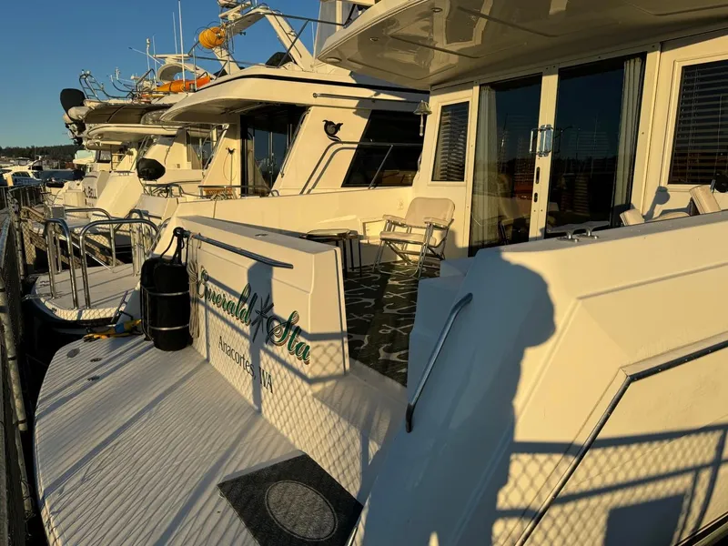Slide: The Image of 2002 Navigator 5700 Rival yacht docked in marina, sunny day. - 6