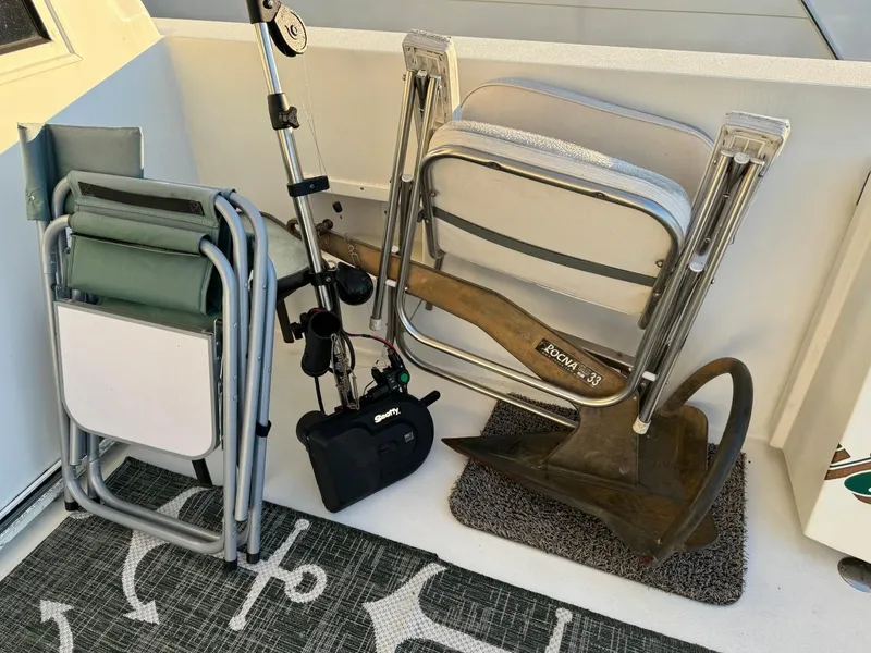 Slide: The Image of Folded chairs and anchor on Navigator 5700 Rival boat, 2002 model. - 7