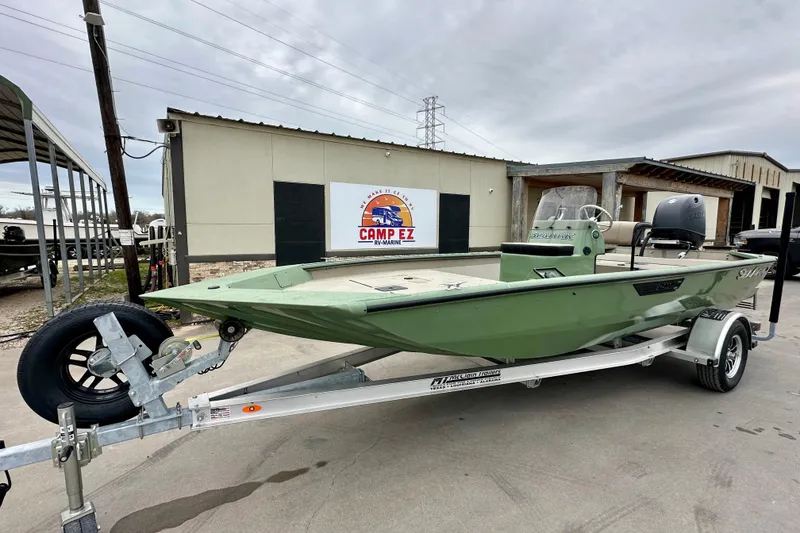 The Image of 2026 SeaArk Shadow 18 boat on trailer at Camp EZ dealership. - 1