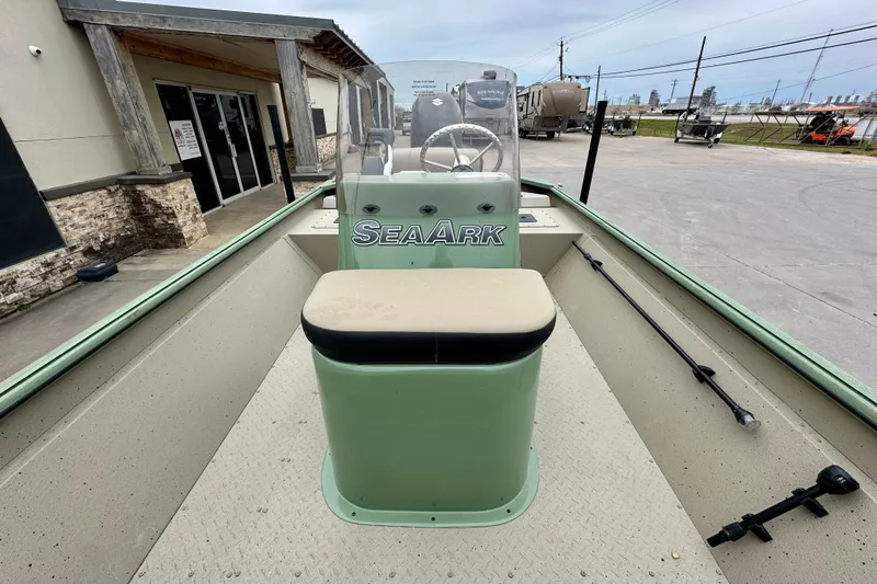 Slide: The Image of 2026 SeaArk Shadow 18 boat interior with steering console and seating. - 15