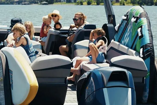 Slide: The Image of Family enjoying a day on a 2026 Flamingo ROVE 245 boat, surrounded by water and sunshine. - 7