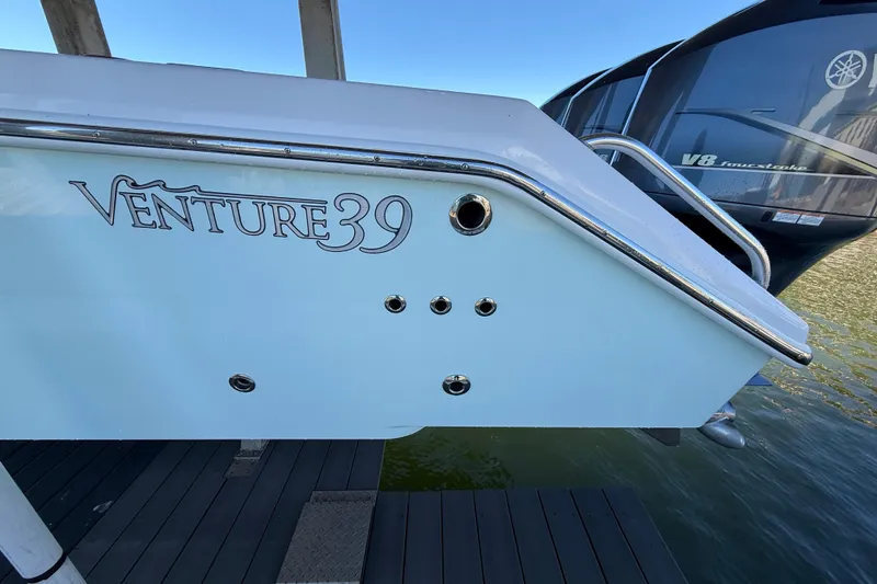 Slide: The Image of 2009 Venture 39 Open boat stern with logo and Yamaha V8 engine. - 7