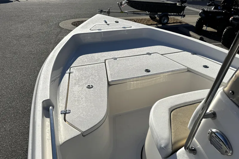 Slide: The Image of 2026 Bulls Bay 2000 boat interior with storage compartments and seating. - 5