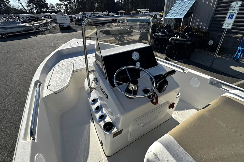Slide: The Image of 2026 Bulls Bay 2000 boat interior with steering wheel and control panel. - 8