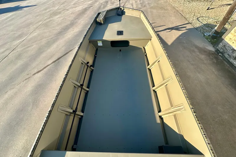 Slide: The Image of 2026 SeaArk 1652 Special boat interior, showcasing spacious, durable design on a sunny day. - 14