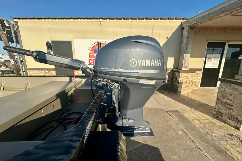 Slide: The Image of 2026 SeaArk 1652 Special boat with Yamaha outboard motor in a sunny outdoor setting. - 7