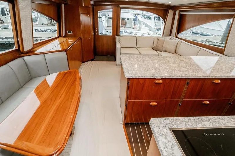 Slide: The Image of Luxurious interior of 2021 Viking 58 Convertible yacht with elegant wood finishes and spacious seating. - 10