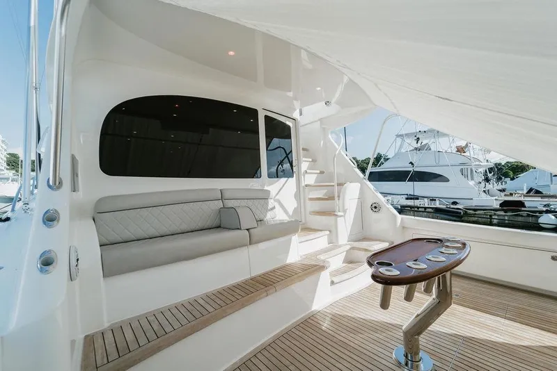 Slide: The Image of Luxurious 2021 Viking 58 Convertible yacht interior with seating and table. - 105