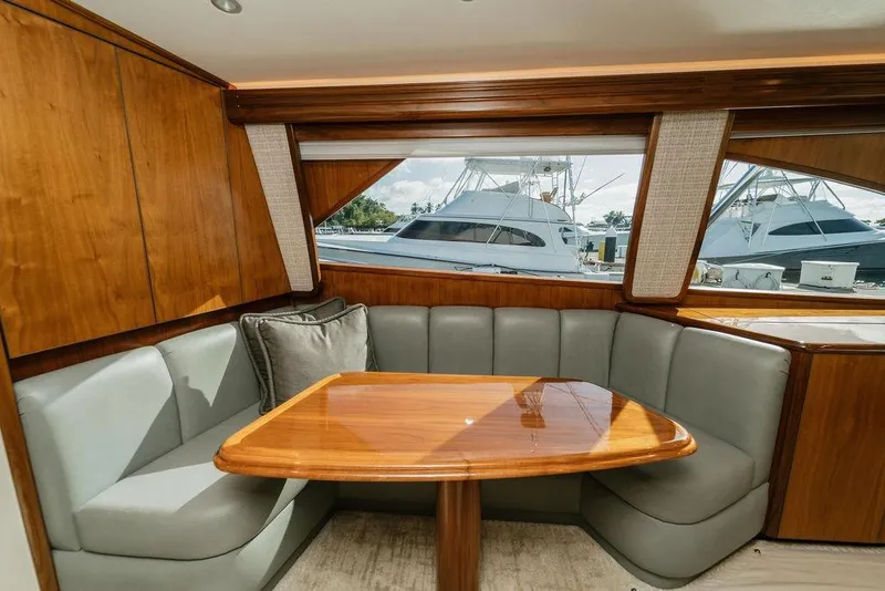 Slide: The Image of Luxurious interior of 2021 Viking 58 Convertible yacht with elegant wood and leather seating. - 109