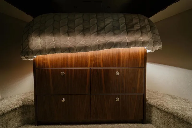 Slide: The Image of Luxurious cabin interior of 2021 Viking 58 Convertible yacht with elegant wood cabinetry. - 115