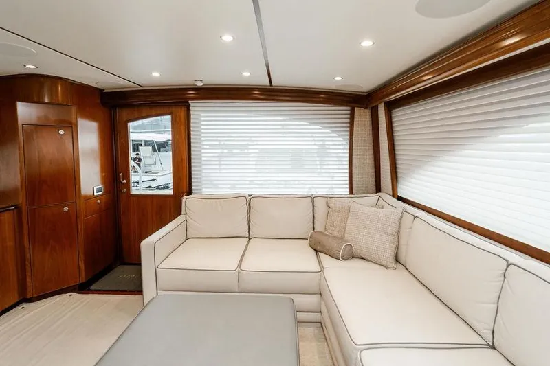Slide: The Image of Luxurious interior of 2021 Viking 58 Convertible yacht with elegant seating and wood accents. - 122