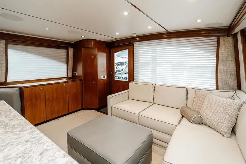 Slide: The Image of Luxurious interior of 2021 Viking 58 Convertible yacht with elegant seating and wood finishes. - 123