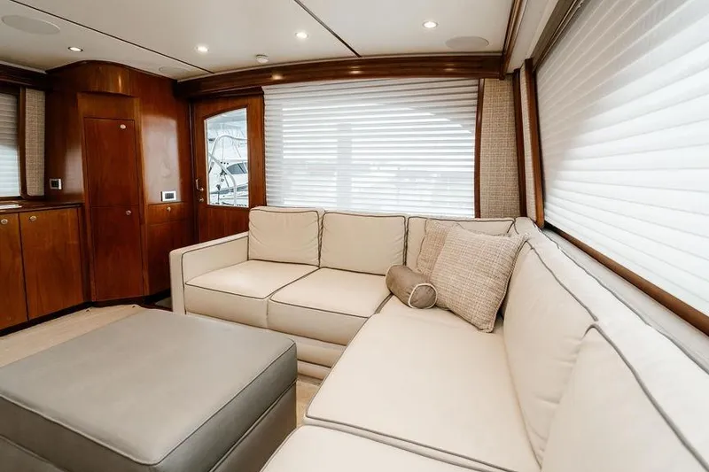 Slide: The Image of Luxurious interior of 2021 Viking 58 Convertible yacht with elegant beige seating. - 124
