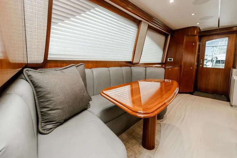 Slide: The Image of Luxurious interior of 2021 Viking 58 Convertible yacht with elegant wood finishes. - 128