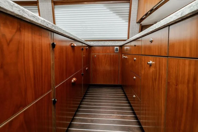 Slide: The Image of Luxurious wooden cabinetry in 2021 Viking 58 Convertible yacht kitchen interior. - 131