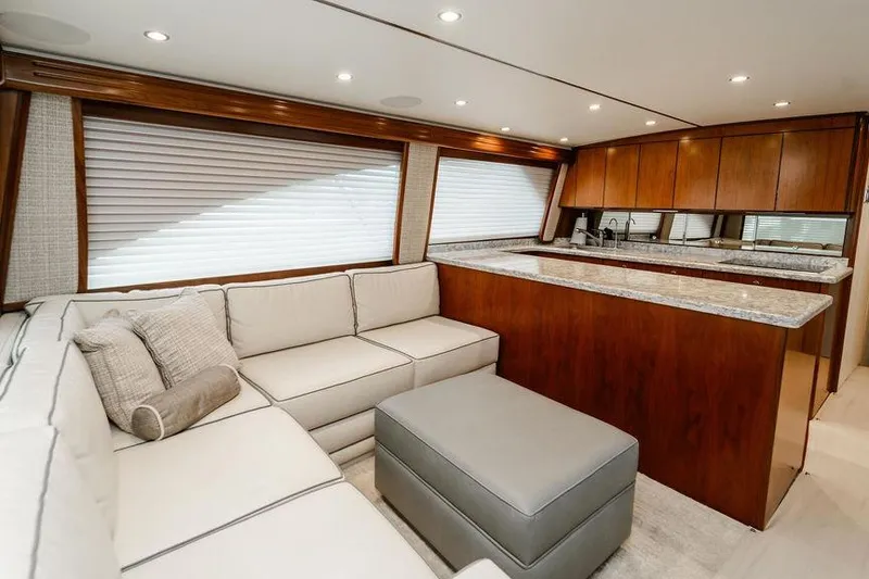 Slide: The Image of Luxurious interior of 2021 Viking 58 Convertible yacht with modern kitchen and cozy seating area. - 133
