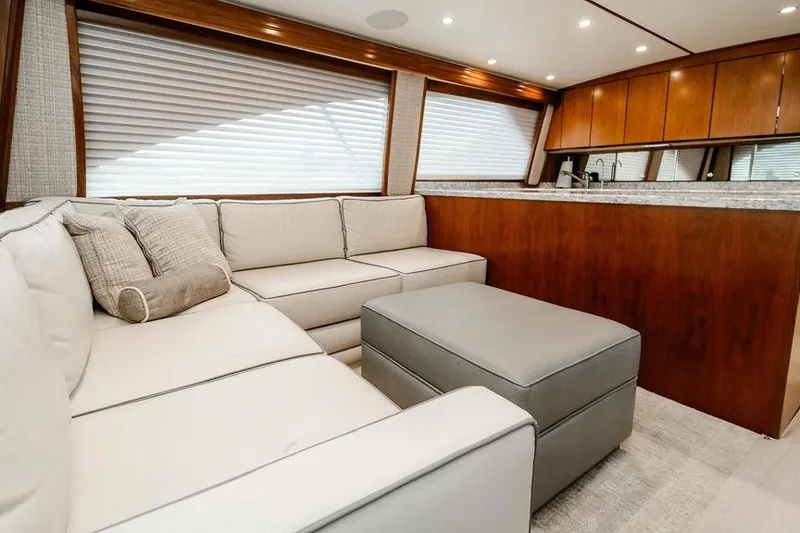 Slide: The Image of Luxurious interior of 2021 Viking 58 Convertible yacht with plush seating and elegant wood finishes. - 134