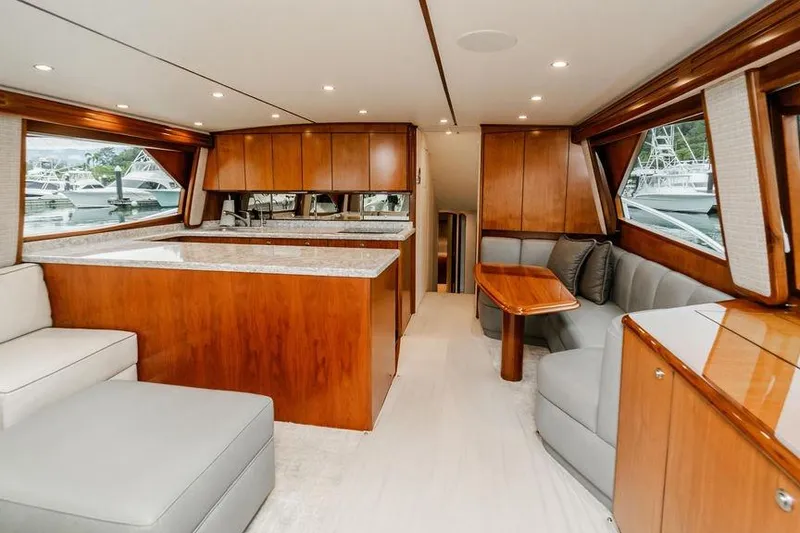 Slide: The Image of Luxurious interior of 2021 Viking 58 Convertible yacht with wood finishes and modern seating. - 135