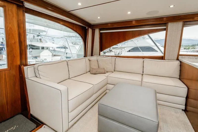 Slide: The Image of Luxurious interior of 2021 Viking 58 Convertible yacht with plush seating and elegant wood finishes. - 136