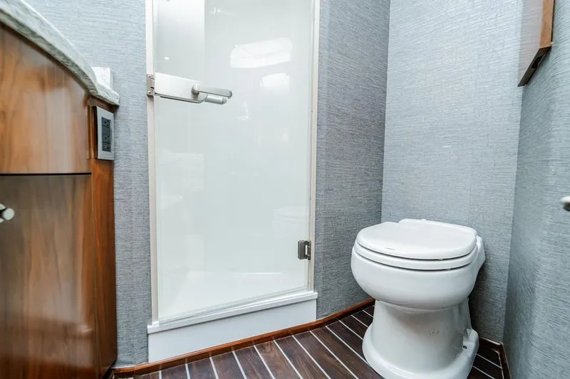 Slide: The Image of Bathroom interior of 2021 Viking 58 Convertible yacht with shower and toilet. - 18