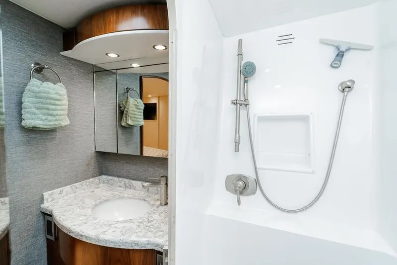 Slide: The Image of Luxurious bathroom in 2021 Viking 58 Convertible yacht with modern fixtures and elegant design. - 20
