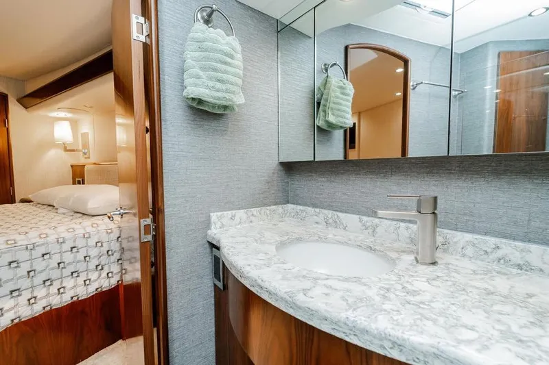 Slide: The Image of Luxurious bathroom and bedroom in 2021 Viking 58 Convertible yacht. - 21