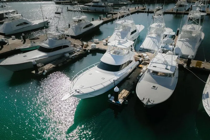 Slide: The Image of Aerial view of 2021 Viking 58 Convertible yacht docked in a marina. - 46
