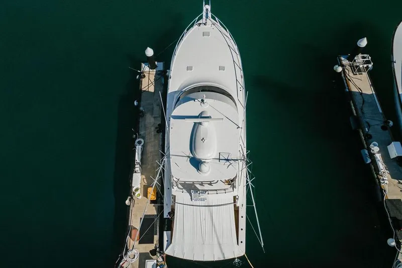 Slide: The Image of Aerial view of 2021 Viking 58 Convertible yacht docked at marina. - 55