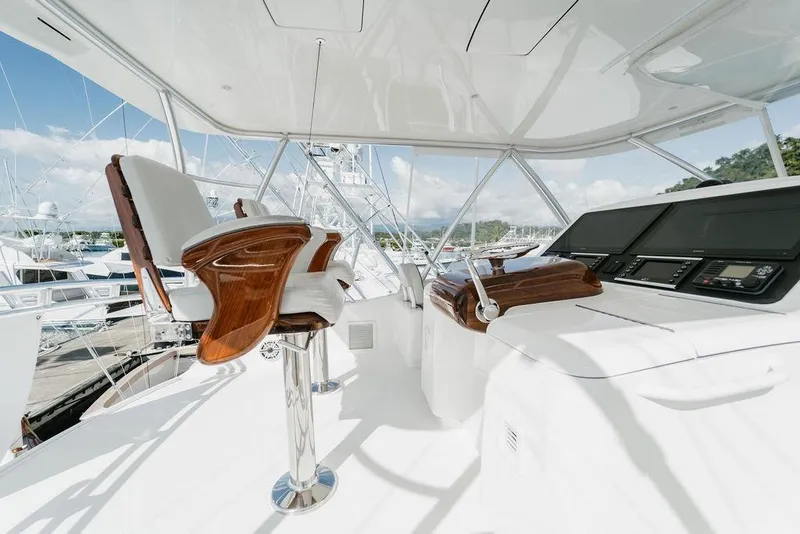 Slide: The Image of Luxurious interior of 2021 Viking 58 Convertible yacht with modern helm and seating. - 58