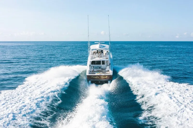 Slide: The Image of 2021 Viking 58 Convertible yacht cruising on open ocean waters. - 6