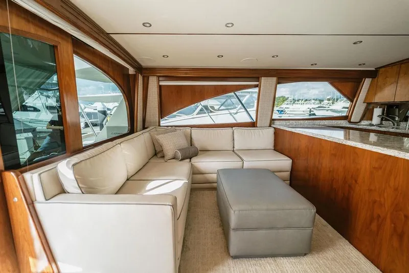 Slide: The Image of Luxurious interior of 2021 Viking 58 Convertible yacht with plush seating and elegant wood finishes. - 60