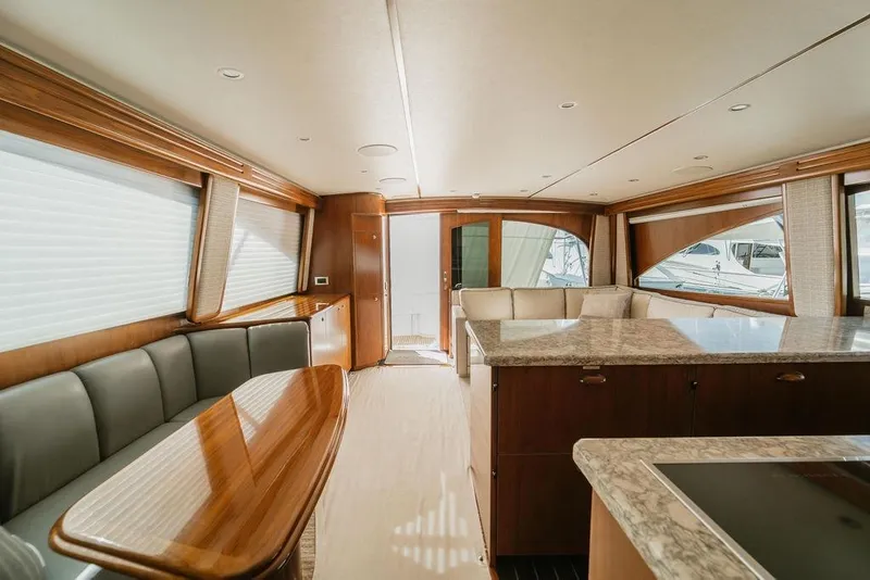 Slide: The Image of Luxurious interior of 2021 Viking 58 Convertible yacht with elegant wood finishes. - 68