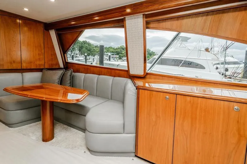Slide: The Image of Luxurious interior of 2021 Viking 58 Convertible yacht with wood finish and plush seating. - 7