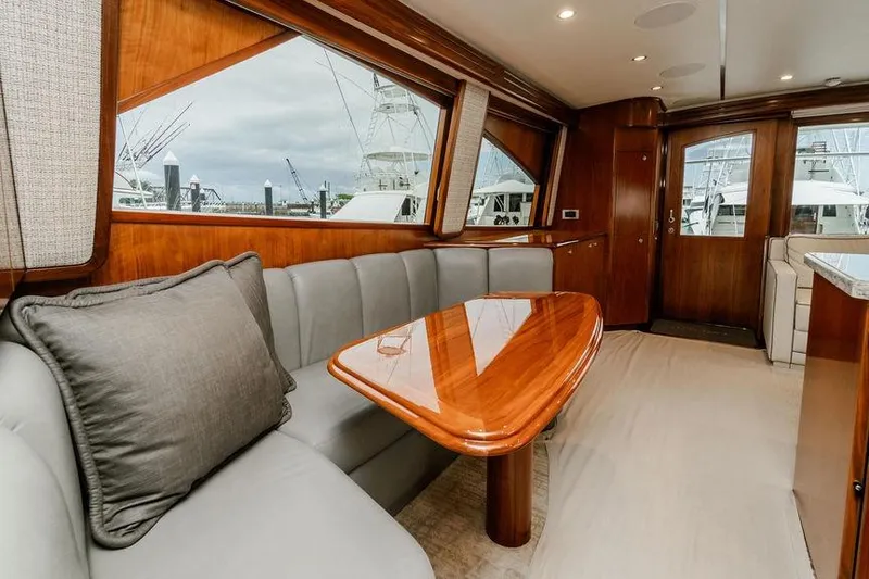 Slide: The Image of Luxurious interior of 2021 Viking 58 Convertible yacht with elegant wood finishes. - 8