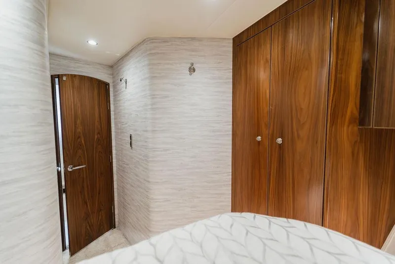 Slide: The Image of Interior of 2021 Viking 58 Convertible yacht with wooden cabinetry and modern design. - 83